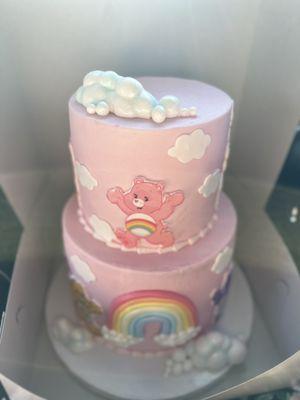 Care Bears baby shower cake. Beautiful and so good. Bottom layer was chocolate tres leches, top layer was strawberry shortcake.