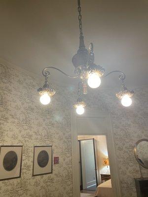 A beautiful, simple light fixture located on the second floor inside the Dillion Home Museum.