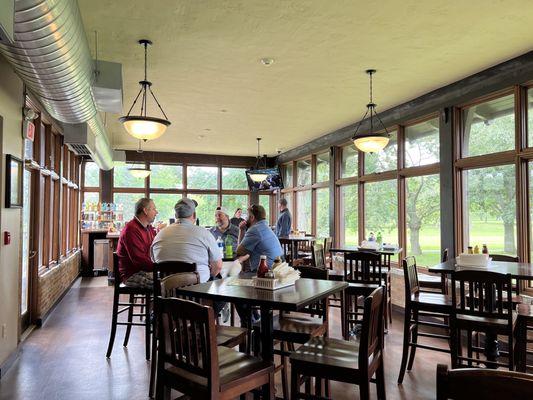 Furthest is the bar itself with half dozen stools or so.