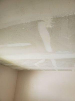 Professional popcorn removal little patching necessary afterwards for smooth ceiling finish.