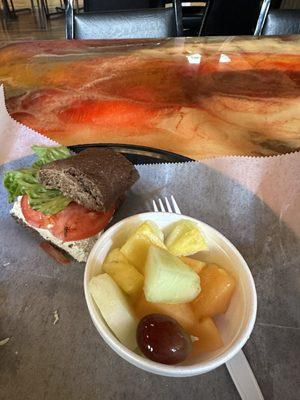 Chicken salad on honey wheat bun with fresh fruit salad. Yum!