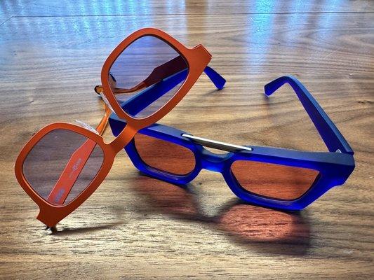 Orange Etnia frames with blue transition lenses  Blue Kirk&Kirk frames with rose transition lenses