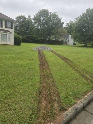 Why would someone drive a dump truck full of gravel on very soiled grass?!?