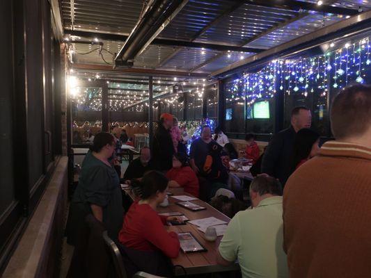 Packed heated patio room for their annual Pizza Nite with Santa, 12-10-2023.