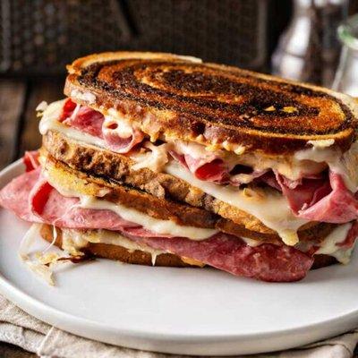 Reuben with 6oz corned beef, sauerkraut, 1000 Island Dressing, swiss cheese on marble Rye