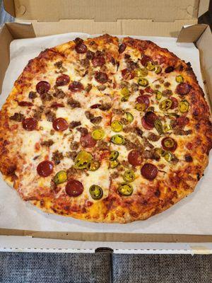 Large cheese, pepperoni, and sausage pizza with jalapeños