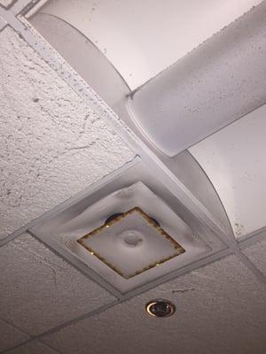 Vents covered in rust, water damage, and dust.