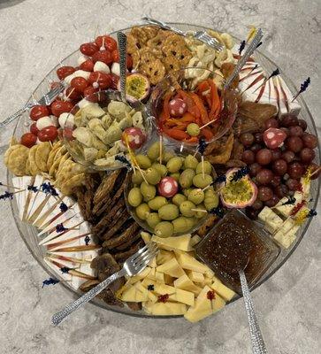 A charcuterie board serving over 50 people. This was from a set of two boards meant to feed over 100 people for a party.