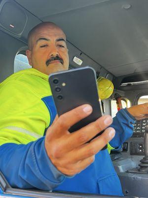 Ruben and his full head of hair. Taking a picture of a man, taking a picture.