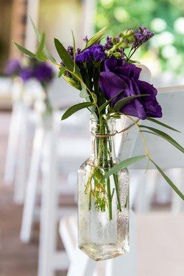 Flowers for chairs at ceremony