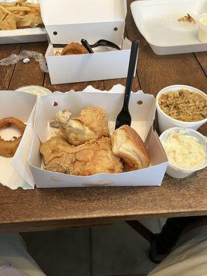 Chicken, dirty rice, coleslaw, onion rings. All good