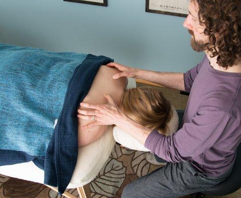 John treating a client at his office in NE Portland.