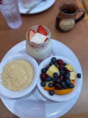 Cheese grits, yogurt parfait, side of fruit.