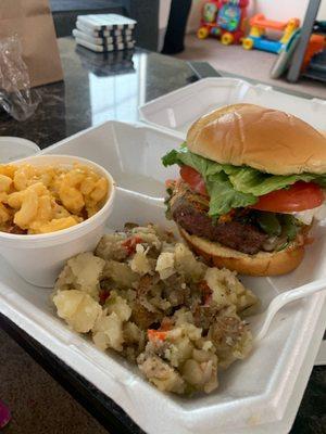 The alarm burger with side of home style potatoes and Mac and cheese.