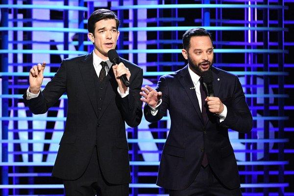 John Mulaney (left) in Reeves three piece suit co hosting the IFC spirit awards.