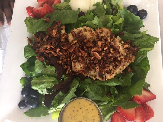 Delicious salad with grilled chicken, roasted pecans, fruit and honey mustard