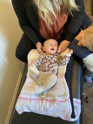 Gentle chiropractic exam and adjustment of a sweet little baby girl.