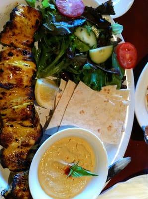 Chicken Kabab with sides of hummus and salad