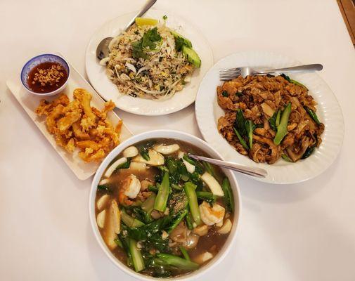 Clockwise from 12 o' clock: Crab Meat Fried Rice, Pad See Ew Chicken, Rad Nar Seafood, Deep Fried Calamari.