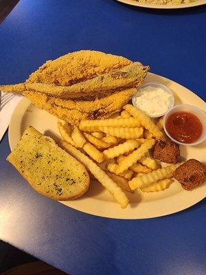 Whole fried catfish, fries, garlic bread, hush puppies