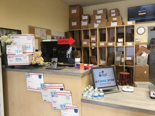 The shipping desk with all the boxes prices label