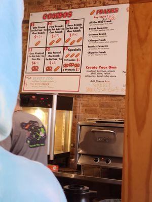 Menu and making hot dogs and pretzels