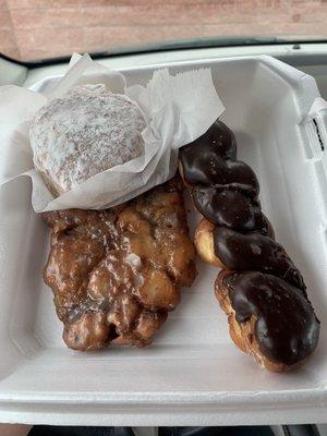 Clockwise: powdered lemon filled doughnuts, chocolate twist and Apple fritter