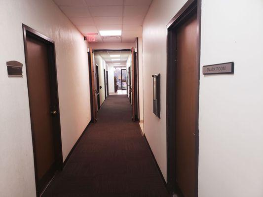 Hallway to suite door and bathrooms