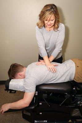 Dr. Nicole adjusting a patient