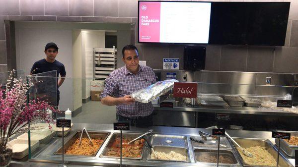 Owner Arof Rawas proudly wrapping his desserts for guests