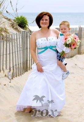 Bare foot bride with ring bearer on the Ocean City,MD beach