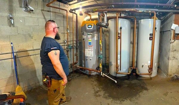 Admiring our water heater and tank install for a condo unit