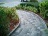 Walkway with paver edge to retain plantings