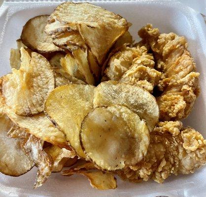 Chicken strips and sliced potatoes