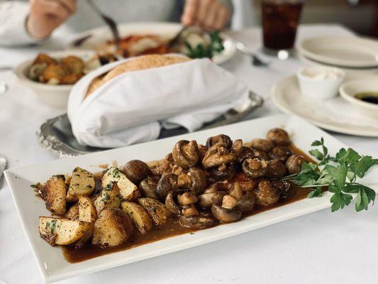 Pork Chop Marsala topped with potatoes and mushrooms