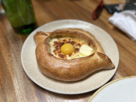 Cheese bread with raw egg and butter