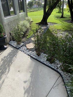 Front door area with stone steps to the backyard.