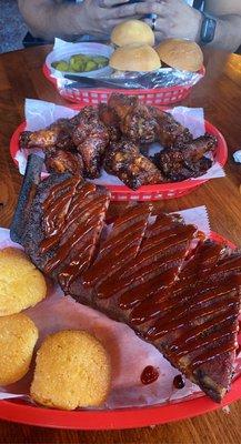 The slider Trio with pickles, traditional wings, and half rack of ribs with the honey butter corn bread!