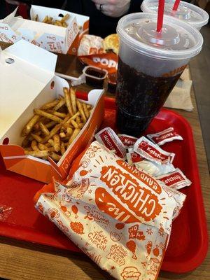 A chicken combo classic with a large Cajun fry and root beer.