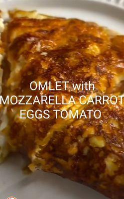 Omlet with mozzarella carrots eggs tomato