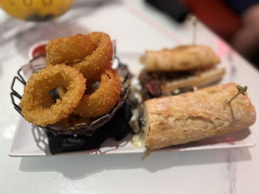 Steak melt sandwich with onion rings