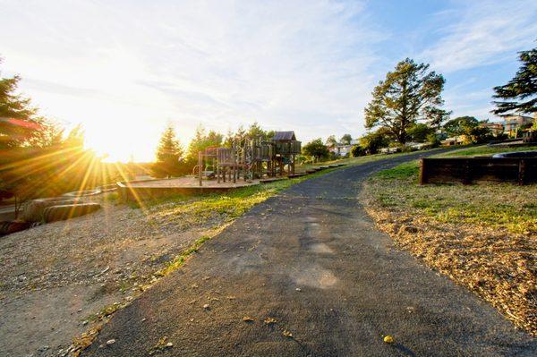 Our play structure and spacious lawn area.