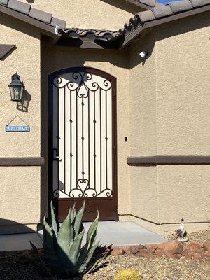 Custom design courtyard front entry security door with kick plate and privacy screen