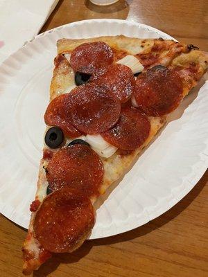 Pizza with pepperoni, olives and onions