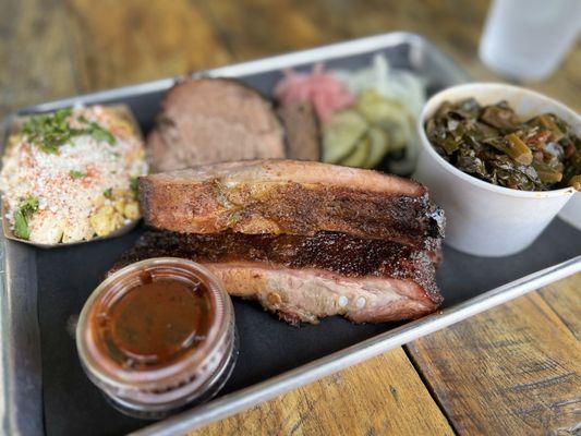 Ribs, briskets, street corn and collard greens, served with bbq sauce and pickles and onions