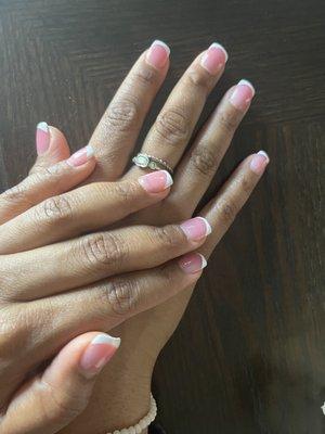 My natural nails treated with the pink powder and French tips.