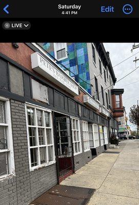 Pete's Barber Shop- gates closed, not locked, customers inside, 4:41pm Saturday