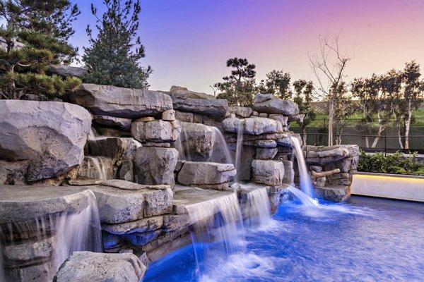 Faux rock waterfall with hidden waterslide