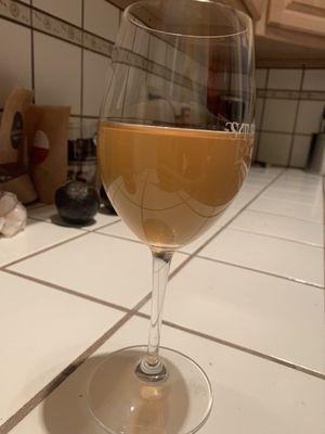 Wine that's turned to vinegar. Separation at the top and brown color.