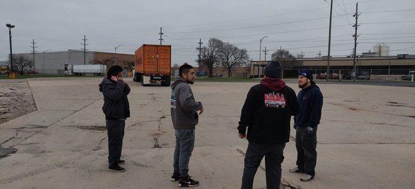 Lalo's Movers Inc waiting to unload a container for a customer.